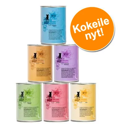 6 eriväristä catz finefood -kissanruokapurkkia, näkyvissä purkkien numerot 3, 5, 7, 9, 11 ja 13. Oikealla oranssi ympyrä, jossa teksti: Kokeile nyt!