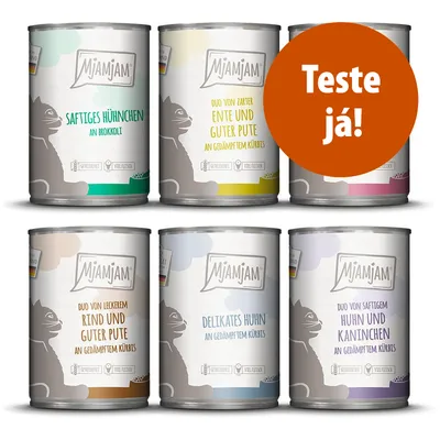 Seis latas de comida para gatos MjAMjAM com rótulos em alemão e círculo laranja com texto 'Teste já!'. Variedades visíveis: frango, pato, peru, vaca, coelho, abóbora, brócolos.