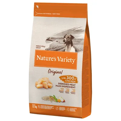 Упаковка корма для собак Nature's Variety Original, 1,5 кг, с курицей 300 г, основным ингредиентом указано мясо без костей. Видны изображения кусочков курицы, риса и овощей. Упаковка корма для собак Nature's Variety Original, 1,5 кг, с курицей 300 г, основным ингредиентом указано мясо без костей. Видны изображения кусочков курицы, риса и овощей.