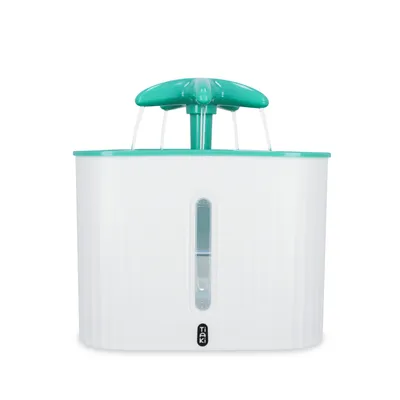 Tiaki fontanella con coperchio verde e flusso d'acqua, corpo bianco con finestra per indicatore del livello dell'acqua.