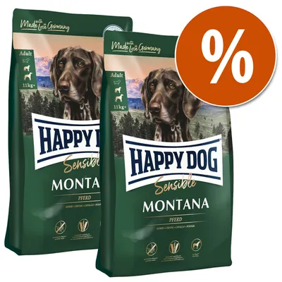 Due confezioni di crocchette per cani Happy Dog Sensible Montana 11 kg+, scritta 'Made with Love in Germany', simbolo percentuale arancione, indicazione gusto cavallo in varie lingue.