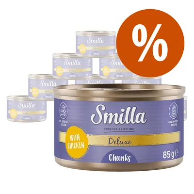 Smilla Deluxe Chunks with Chicken, 85 g konzerv csomag, akciós százalékjelzéssel. Feliratok: 'No added sugar', 'Grain-free recipe', 'With chicken'.