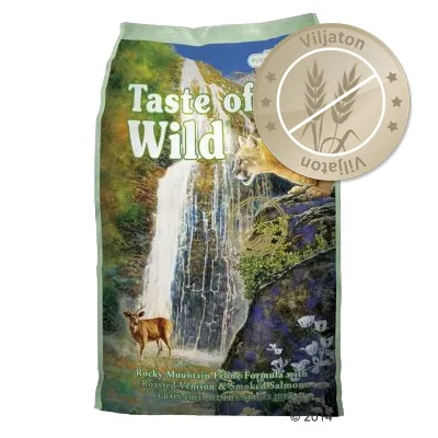 Taste of the Wild -pussi, etupuolella vesiputous ja eläimiä. Oikeassa yläkulmassa pyöreä merkki: Viljaton. Taste of the Wild -pussi, etupuolella vesiputous ja eläimiä. Oikeassa yläkulmassa pyöreä merkki: Viljaton.