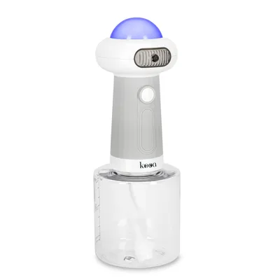 kooa spray device with transparent container and blue illuminated dome, suitable for liquids. Visible measuring scale on the container.