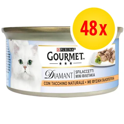 Purina Gourmet Diamant Sfilaccetti Mini Filettakia con tacchino naturale, confezione da 48. Immagine di un gatto bianco e carne su piatto visibili sull'etichetta.