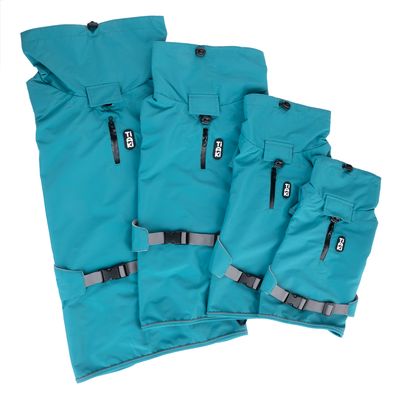 Four turquoise waterproof bags with TIAKI logo, zippers and adjustable straps in various sizes.