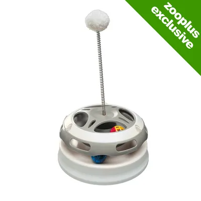 Interactive toy with a round base, two balls inside track, and a spring rod topped with a white pompom. Green corner label reads 'zooplus exclusive'.