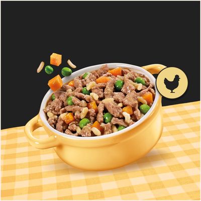 Bol cu bucăți de carne, mazăre, morcovi și paste. Simbolul unui pui indică prezența puiului ca ingredient.