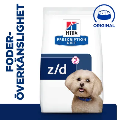 Hill's Prescription Diet z/d hundfoder, text: FODERÖVERKÄNSLIGHET och ORIGINAL, förpackning med blå och vit design samt synlig hundkropp framför påsen.