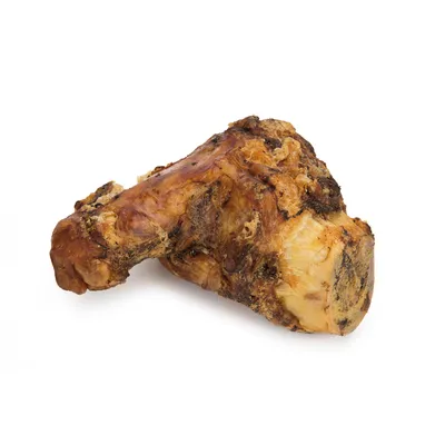 Os de jambon naturel entier, sans emballage ni marque visible, surface dorée et brune, texture irrégulière, présenté sur fond blanc.