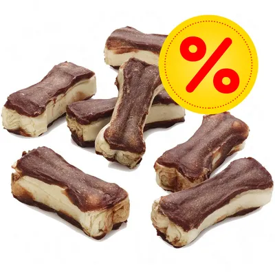Hondenkluiven met bruine buitenlaag, meerdere stuks bij elkaar. Gele kortingscirkel met rood procentteken zichtbaar op de afbeelding. Hondenkluiven met bruine buitenlaag, meerdere stuks bij elkaar. Gele kortingscirkel met rood procentteken zichtbaar op de afbeelding.