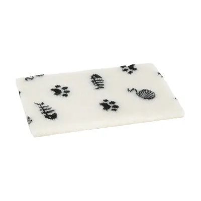 White mat with black motifs: paw prints, fish bones and balls of wool. Suitable as a base or decoration.