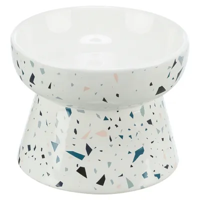 Bol ceramic cu suport înălțat, design alb cu modele terrazzo colorate.
