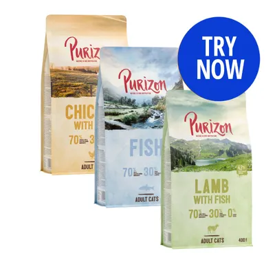 Three Purizon adult cat food bags: Chicken with 70% animal ingredients, Fish with 70% animal ingredients, and Lamb with Fish. Blue circle reads 'Try Now'.