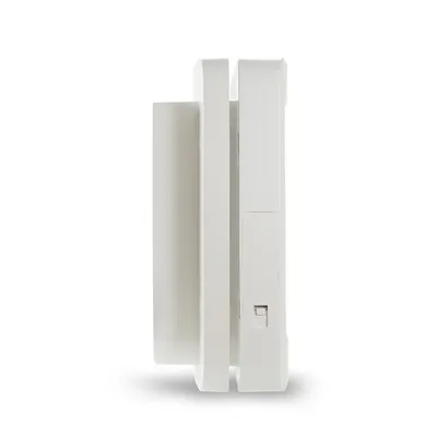 White plastic device with rectangular shape and side switch, side view.