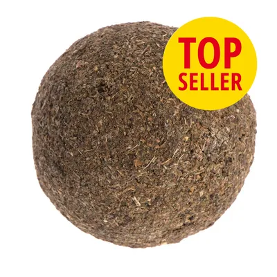 Brun bold af presset plantemateriale med gul cirkel og rød tekst: TOP SELLER Brun bold af presset plantemateriale med gul cirkel og rød tekst: TOP SELLER