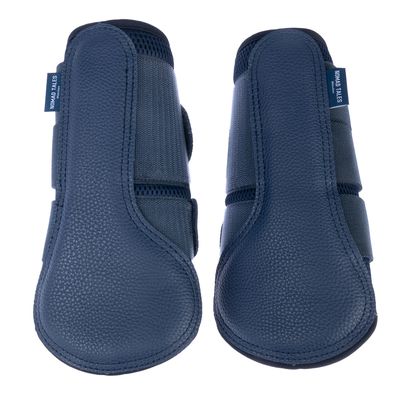 Due blue protezioni per zoccoli in tessuto e similpelle, etichetta del marchio 'Nomad Tales' visibile.