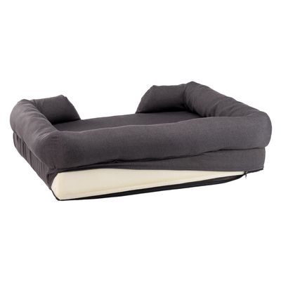 Grijs huisdierenbed met verhoogde rand en afneembare hoes, zichtbare vulling en ritssluiting.