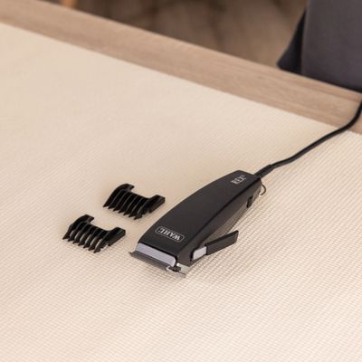 WAHL REX Haarschneidemaschine, schwarzes Design mit Kabelanschluss und seitlichem Hebel.