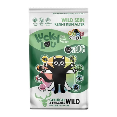 Lucky Lou The Real Taste Senior, Geflügel & Frisches Wild. Texto en inglés y alemán. Iconos: sin patata, sin cereales, sin azúcar añadido. Imagen de gato negro con ilustraciones.