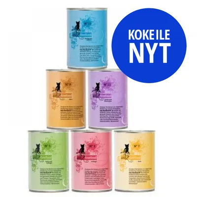 MAC's Cat finefood -kissanruokapurkkeja eri väreissä, näkyvillä tekstit N° 13, N° 9, N° 11, N° 5, N° 3, N° 7. Sininen ympyrä: KOKEILE NYT.