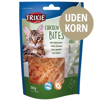 TRIXIE Chicken Bites, 50 g. UDEN KORN. Med kylling. 0 % tilsat sukker. Glutenfrei. Vindue viser strimler af produktet. Tekst på flere sprog: Mit Huhnchen, With chicken, Avec poulet, Con pollo.