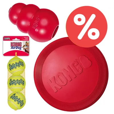 KONG Spielzeug-Set mit rotem KONG Classic, roter Frisbee und gelben AirDog Tennisbällen im Netz. Rabatt-Symbol oben rechts.