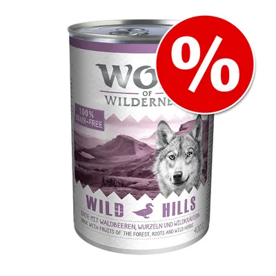 Konzerva Wolf of Wilderness Wild Hills, 100 % grain-free, kačica s lesnými plodmi, koreňmi a bylinkami, 400 g. Červený symbol percenta v pravom hornom rohu.