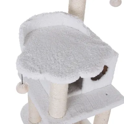 Cat tree with white plush cover, cave and platform. Sisal-wrapped posts and hanging toy visible.