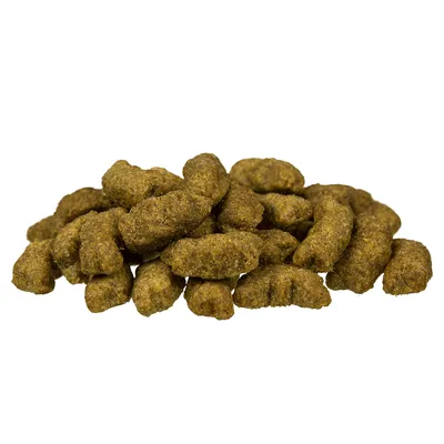 Brown, shaped dry food pieces in a heap view. No other visible information.