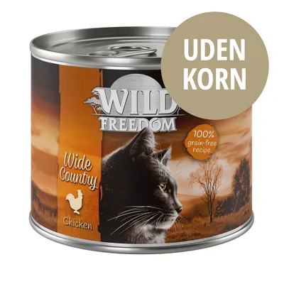 Wild Freedom Wide Country Chicken kattemad dåse, 100% grain-free recipe, UDEN KORN står på mærkat. Billede af sort kat og landskab på emballagen.