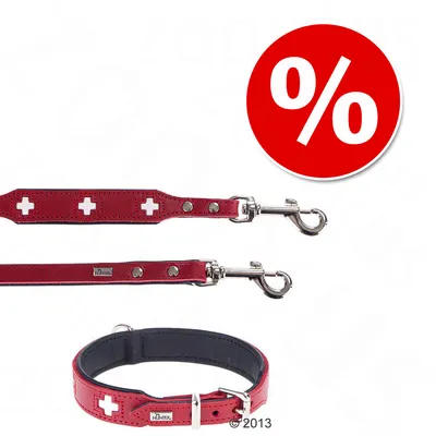 Rødt hundehalsbånd og line med hvide kors, metalspænder og mærketekst 'Hunter'. Rød cirkel med hvidt procenttegn i øverste hjørne. Rødt hundehalsbånd og line med hvide kors, metalspænder og mærketekst 'Hunter'. Rød cirkel med hvidt procenttegn i øverste hjørne.