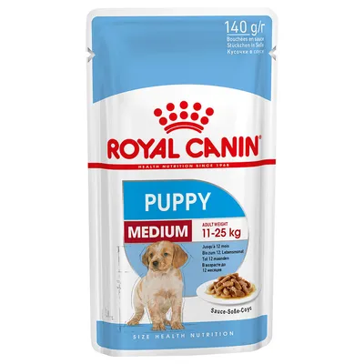 Royal Canin Puppy Medium märkäruoka-annospussi, 140 g. Aikuispaino 11–25 kg. Näkyvissä koiran kuva ja annos ruokaa lautasella. Tuotetiedot useilla kielillä.