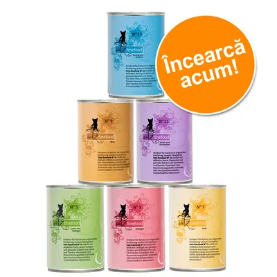 Conserve catz finefood pentru pisici, sortimente N°3, N°5, N°7, N°9, N°11, N°13. Etichetă vizibilă cu text în germană. Inscripție portocalie: Încearcă acum!