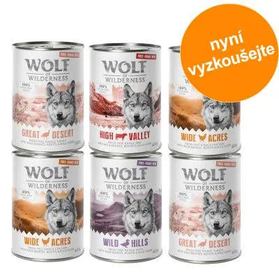 Šest konzerv Wolf of Wilderness: Great Desert, High Valley, Wide Acres, Wild Hills. Oranžový kruh s textem 'nyní vyzkoušejte'. Šest konzerv Wolf of Wilderness: Great Desert, High Valley, Wide Acres, Wild Hills. Oranžový kruh s textem 'nyní vyzkoušejte'.