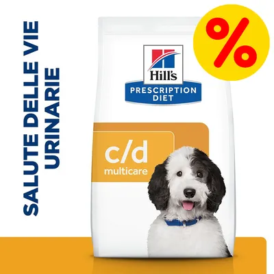 Hill's Prescription Diet c/d multicare, confezione con cane, testo visibile: SALUTE DELLE VIE URINARIE, simbolo percentuale giallo e rosso in alto a destra.