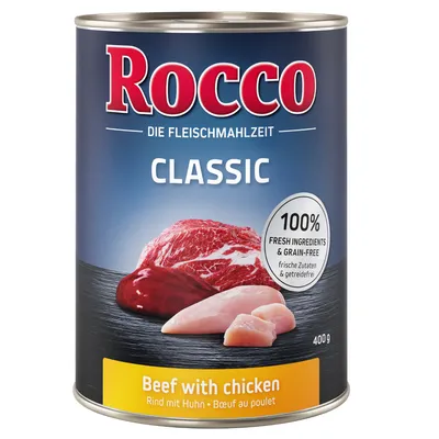 Rocco Classic konzerva 400 g, Beef with chicken, 100% fresh ingredients & grain-free, prikaz komada govedine i piletine na tamnoj podlozi. Tekst na engleskom i njemačkom jeziku.