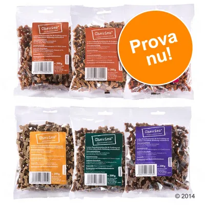 Sex påsar Chewies hundgodis, 200 g per påse, med olika färgade etiketter och synlig texten 'Prova nu!' i orange cirkel. Sex påsar Chewies hundgodis, 200 g per påse, med olika färgade etiketter och synlig texten 'Prova nu!' i orange cirkel.