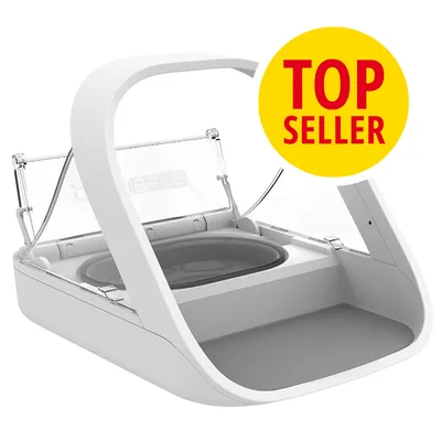 Gamelle automatique blanche avec couvercle transparent, texte visible : TOP SELLER sur un cercle jaune. Marque partiellement lisible : SURE.