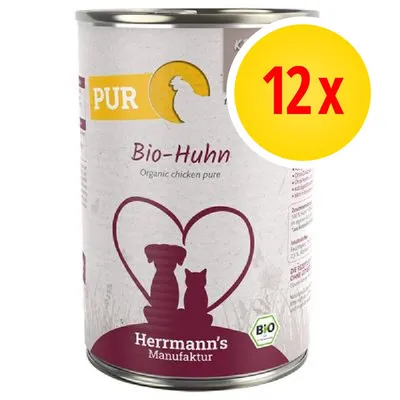 Confezione da 12 x Herrmann's Manufaktur Bio-Huhn, scritta 'Organic chicken pure', illustrazione cane e gatto, etichetta BIO visibile sulla lattina.