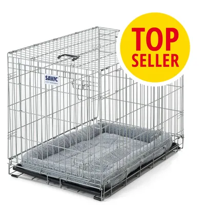 Jaula metálica Savic con base acolchada gris. Etiqueta visible: TOP SELLER en círculo amarillo y rojo.