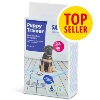 Puppy Trainer super absorbent training pads, XL 30 pezzi, 90 x 60 cm, con immagine di cucciolo su tappetino. Etichetta gialla: TOP SELLER. Testo in inglese visibile sulla confezione.