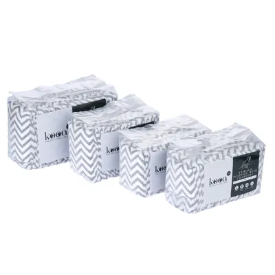 kooa. Packaging of pet care products with chevron pattern, visible in four sizes.