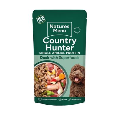 Country Hunter single animal protein duck with superfoods, with natural ingredients, no grain, hypoallergenic. Image shows food mix and a dog.