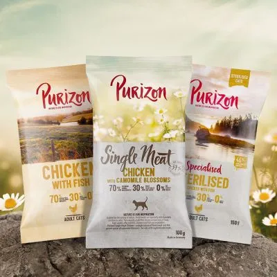 Tres bolsas de comida para gatos Purizon: Chicken with Fish, Single Meat Chicken with Camomile Blossoms y Specialised Sterilised. Textos visibles: 70 % carne, 30 % vegetales, 0 % cereales.