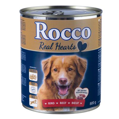 Blik Rocco Real Hearts hondenvoer, 800 g. Tekst: Rind Beef Boeuf, met afbeelding van hond en pictogrammen voor extra grote vleesstukken, vers vlees 100%, kracht & energie.