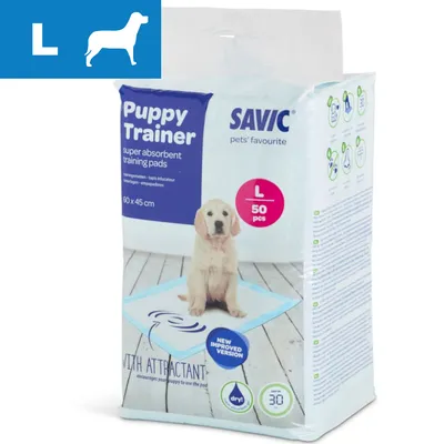 Savic Puppy Trainer super absorbent training pads, L 50 pcs, 60 x 45 cm. Billede af hvalp på træningsmåtte. Tekst: new improved version, with attractant, dry! 30.