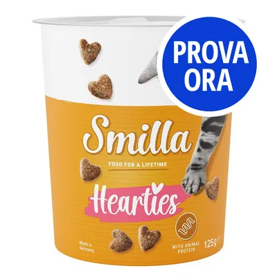 Confezione Smilla Hearties 125g, con scritte 'FOOD FOR A LIFETIME', 'WITH ANIMAL PROTEIN', 'Made in Germany' e bollino blu 'PROVA ORA'. Crocchette a forma di cuore visibili.