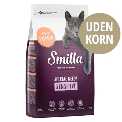 Smilla Special Needs Sensitive kattefoder, rich in salmon, uden korn, 1 kg. Tekst: grain-free recipe, contains taurine, omega fatty acids, yucca schidigera. Billede af grå kat.