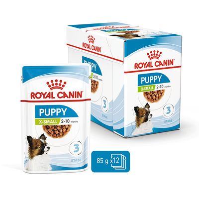 Royal Canin Puppy X-Small 2-10 months, stage 3, pack of 12 x 85g pouches shown with product box and pouch.